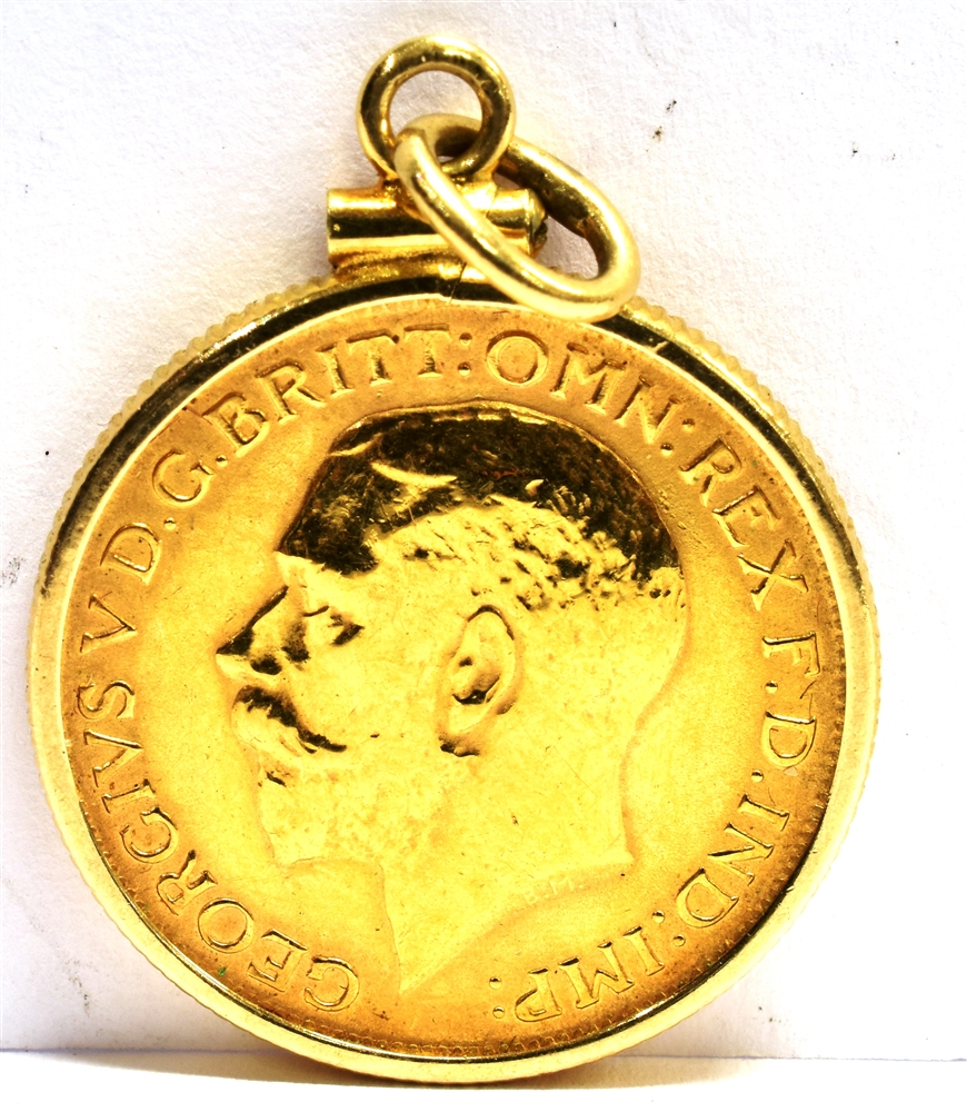 A FULL SOVEREIGN GOLD PENDANT the coin dated 1915with simple 9ct gold bezel surround with milled