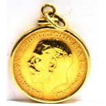 A FULL SOVEREIGN GOLD PENDANT the coin dated 1915with simple 9ct gold bezel surround with milled