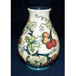 A MOORCROFT POTTERY OVOID VASE decorated in the 'Bryony' (Special occasions) pattern, impressed