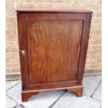 A VICTORIAN CABINET, the top with moulded edge, the door with ebonised line inlay and crossbanded