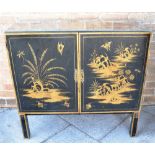 A BLACK LACQUERED CABINET with gilt Chinoiserie decoration, 91cm wide 41cm deep 86cm high