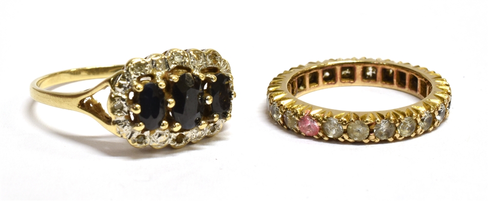 TWO 9CT GOLD STONE SET DRESS RINGS comprising a sapphire and small diamond oval cluster (note two