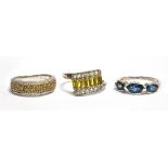 THREE SILVER DRESS RINGS one a diamond set half eternity band ring, comprising pave set small