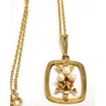 A 9CT GOLD CULTURED PEARL SET PENDANT AND CHAIN the openwork cushion shaped pendant with three small