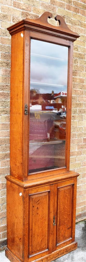 A VICTORIAN OAK SIDE CABINET OF NARROW PROPORTIONS with swan neck pediment and shaped cornice - Image 3 of 4