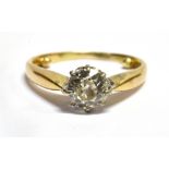 A DIAMOND SOLITAIRE GOLD RING the round old brilliant cut diamond weighing approx. 0.75 carat,