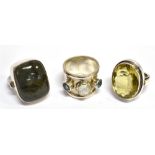 THREE LARGE STONE SET SILVER DRESS RINGS comprising a large oval cut citrine, approx. 22mm x 17mm,