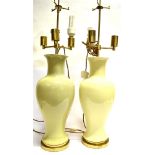 A VERY LARGE PAIR OF CELADON COLOURED TABLE LAMPS of baluster form with elongated necks, brass