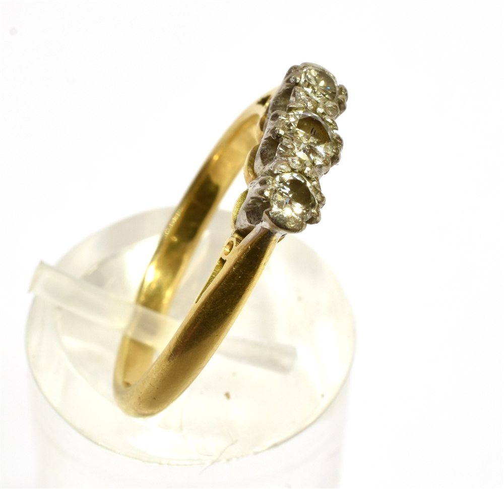 A DIAMOND THREE STONE RING the round brilliants approx. 0.60cts, claw set in white, on a yellow ' - Image 2 of 4