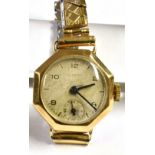 A LADIES VINTAGE 9CT GOLD DERRICK WRISTWATCH on a plated expanding bracelet, winding mechanical