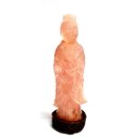 A CHINESE CARVED ROSE QUARTZ FIGURE OF GUANYIN standing in serene pose, on carved and pierced