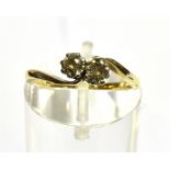 A DIAMOND TWO STONE CROSSOVER 18CT GOLD RING two round brilliant cut diamonds weighing a total of