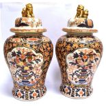 A PAIR OF LARGE CONTEMPORARY LIDDED VASES of baluster form, decorated in the Imari palette, the