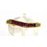 A 14CT GOLD RUBY AND WHITE STONE SET HALF ETERNITY RING the shaped eternity ring with seven small