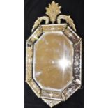 A LARGE VENETIAN STYLE WALL MIRROR of octagonal form with shaped crest, 53cm wide 92cm high