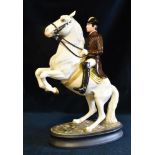 A BESWICK MODEL OF A REARING LIPIZZANER HORSE WITH RIDER model no. 2467, approximately 24cm high