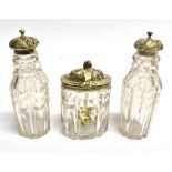 THREE VICTORIAN SILVER TOPPED CUT GLASS ITEMS comprising a pair of castors with pierced floral