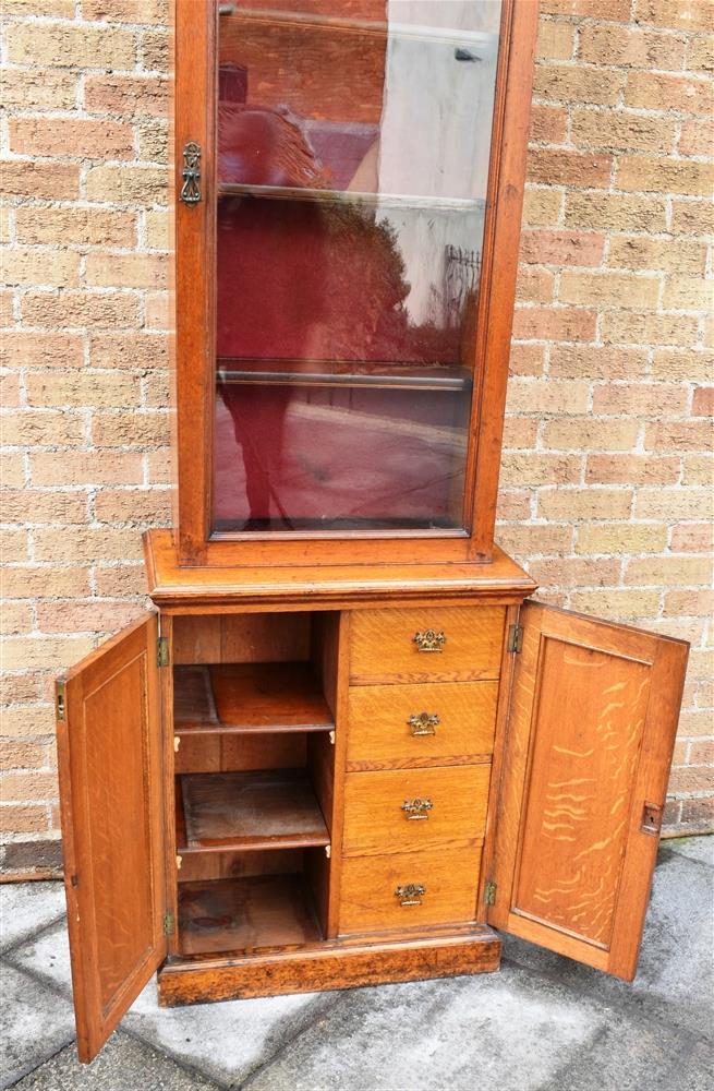 A VICTORIAN OAK SIDE CABINET OF NARROW PROPORTIONS with swan neck pediment and shaped cornice - Image 2 of 4