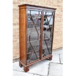 A MAHOGANY BOOKCASE the astragal glazed doors opening to four adjustable shelves, 97cm wide 35cm