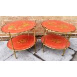 A PAIR OF BRASS BOUND OVAL TWO-TIER TROLLEYS with red lacquer Chinoiserie decoration, the uprights