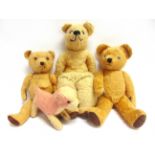THREE TEDDY BEARS & A SOFT TOY DOG most circa 1950s, the largest 44cm high.