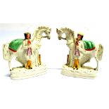 A PAIR OF STAFFORDSHIRE FLATBACK EQUESTRIAN GROUPS 23cm high