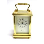 A BRASS CASED CARRIAGE CLOCK the enamel dial with Roman hour markers and Arabic minutes, signed '