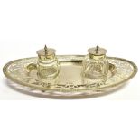 A SILVER INK STAND the oval two bottle ink stand with pierced heart, floral and scroll decoration,