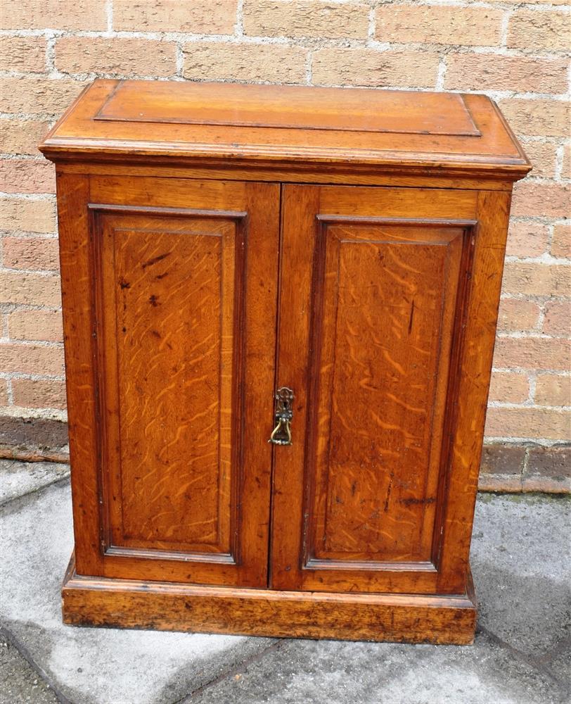 A VICTORIAN OAK SIDE CABINET OF NARROW PROPORTIONS with swan neck pediment and shaped cornice - Image 4 of 4