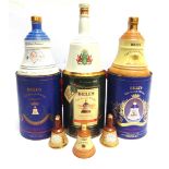 [WHISKY]. NINE BELL'S COMMEMORATIVE & OTHER WHISKY DECANTERS by Wade, each with contents, three of