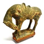 A CHINESE TERRACOTTA TANG DYNASTY STYLE HORSE with conforming hardwood stand, 20cm high overall