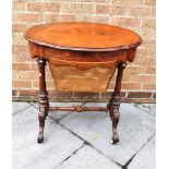 A VICTORIAN BURR WALNUT WORK TABLE the oval top 68cm wide 48cm deep, fitted with satinwood lined