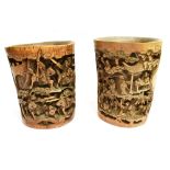 A LARGE PAIR OF CHINESE BAMBOO BRUSH POTS each with relief carving to the front, one depicting