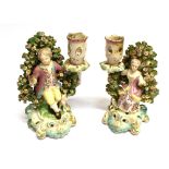 A PAIR OF SOFT-PASTE 18TH CENTURY ENGLISH PORCELAIN BOCAGE FIGURAL CANDLESTICKS probably Derby,