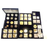ASSORTED COLLECTOR'S COINS in nine storage boxes, (total 45 coins).