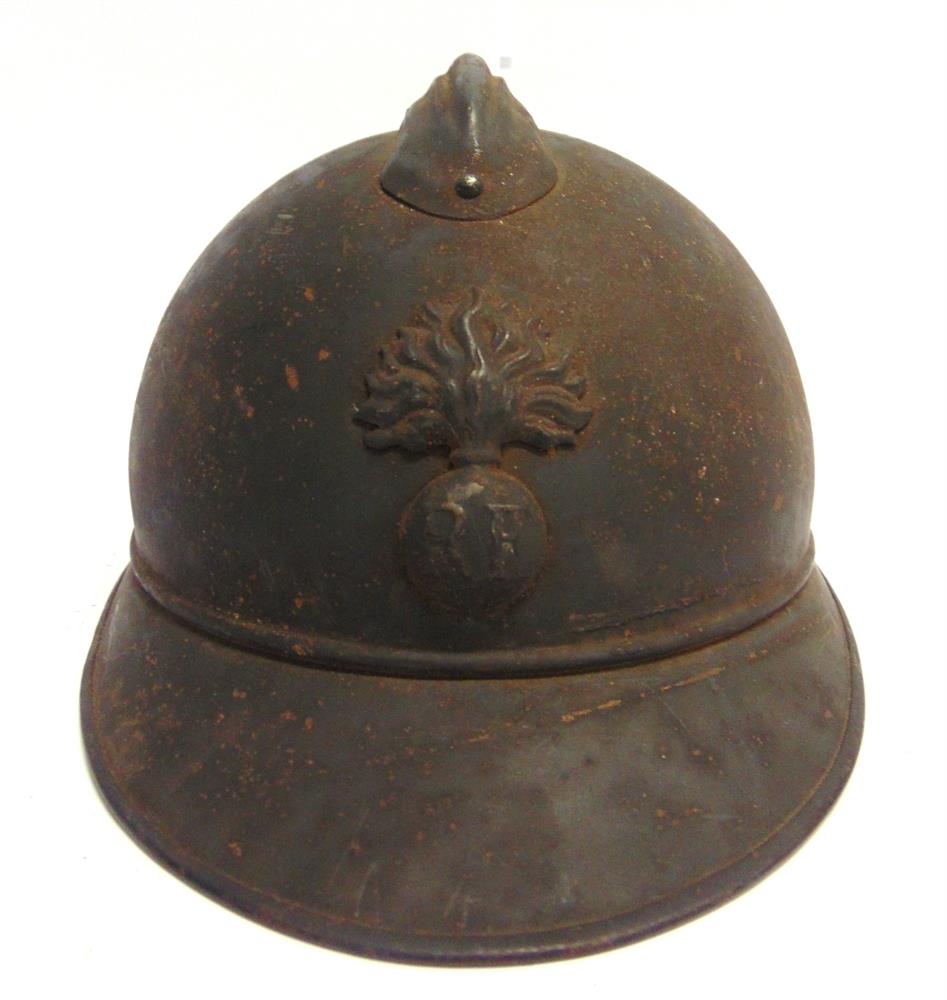 A GREAT WAR FRENCH M15 ADRIAN HELMET the shell with standard 'RF' badge and ventilated comb, leather