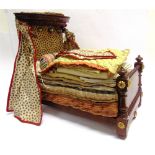 A VICTORIAN DOLL'S MAHOGANY HALF TESTER BED together with a mattress, bolster and bedding, 40.5cm