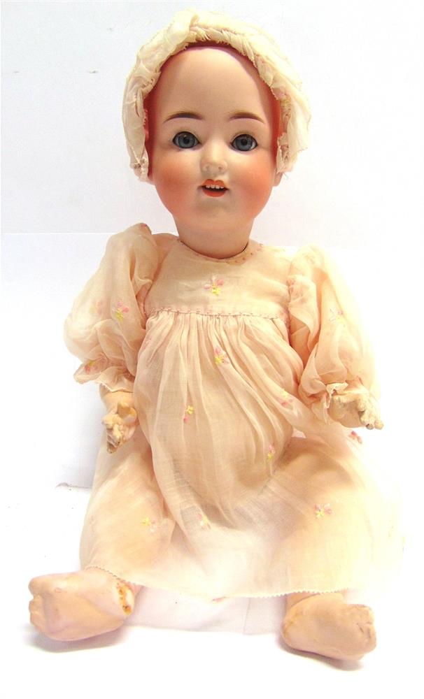 A WEIFEL & CO. BISQUE SOCKET HEAD DOLL with sleeping blue-grey glass eyes, and an open mouth with