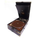 AN H.M.V. PORTABLE GRAMOPHONE with an H.M.V. No.4 reproducer, in a black rexine-covered case (