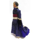 A 19TH CENTURY COMPOSITION DOLL with moulded and painted hair and facial features, on a kid