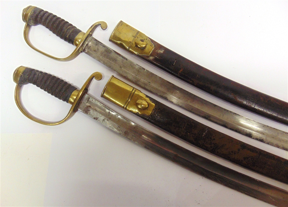 A MATCHED PAIR OF VICTORIAN CONSTABULARY SHORT SWORDS the 59.5cm curved steel blades without