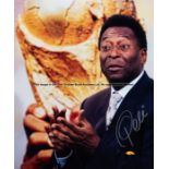 Pele signed large colour photoprint, portrait against a backdrop featuring an enlarged image of