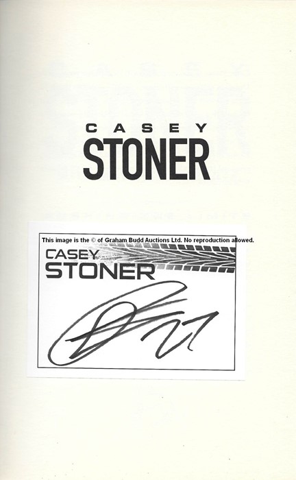 Casey Stoner signed MotoGP memorabilia, comprising signed book and 8 by 12in. action photograph of - Image 2 of 4