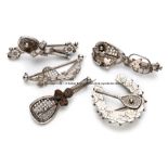 Five tennis related brooches, comprising of a horseshoe and racquet with gilt floral highlights,