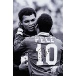 Pele signed large b&w photoprint featuring him embracing boxing legend Muhammad Ali at a New York