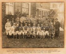 Sepia team photograph of leading jockeys, circa 1920s, group study of 31 jockeys, lined up in