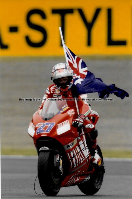 Casey Stoner signed MotoGP memorabilia, comprising signed book and 8 by 12in. action photograph of - Image 4 of 4