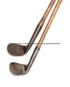 Two 19th century smooth face rut irons, each with heavy iron head, hickory shaft, one with