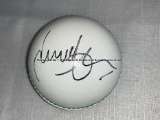 James Anderson England cricket memorabilia, comprising two cricket balls, one white, one red, an 8