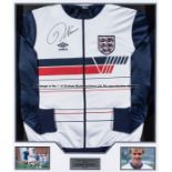 Kerry Dixon signed match-worn England tracksuit top season 1985-86, mounted with two colour photos